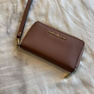 Michael Kors mauve color Women’s Wallet with wrist handle